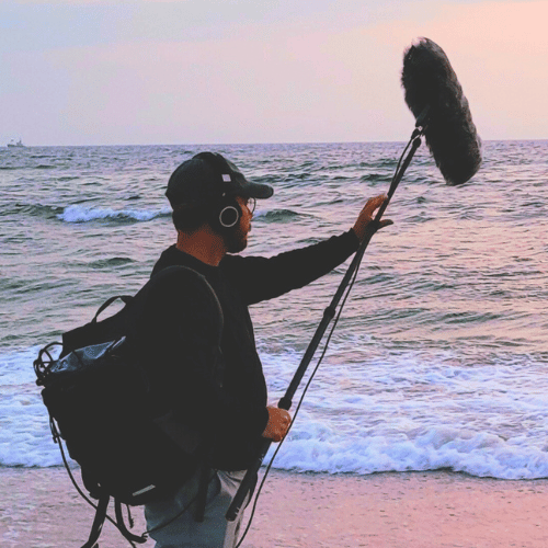 Picture of Mikkel Recording waves on the beach